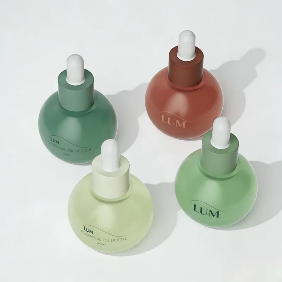 Close-up of the ergonomic round silhouette and tight dropper collar, engineered to prevent leakage during transit.