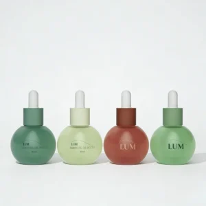 Unique round serum packaging manufactured by Lumlun, featuring the LUM logo on elegant frosted green containers.