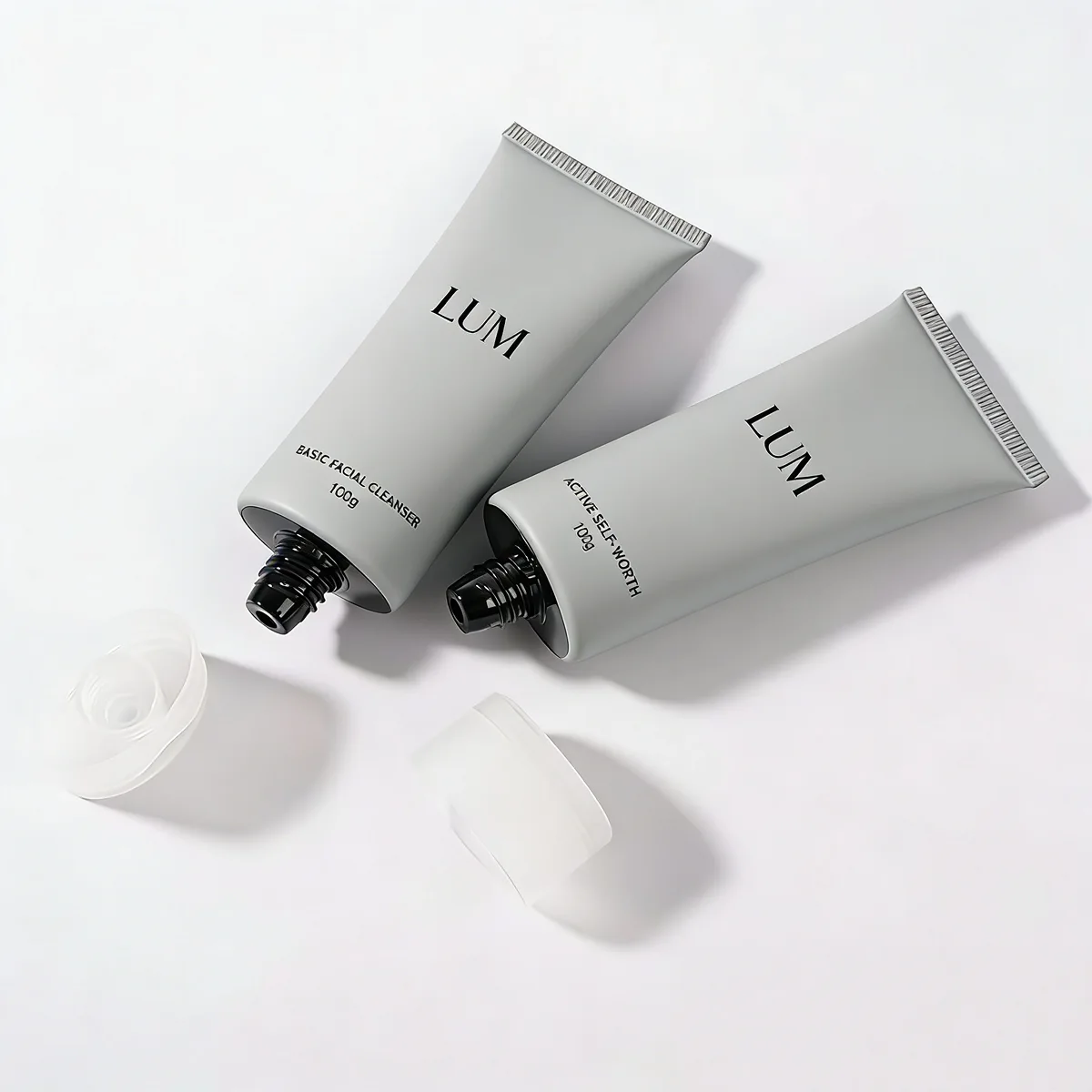 Minimalist men's skincare packaging manufactured by Lumlun, featuring the LUM logo on a sleek matte grey finish.