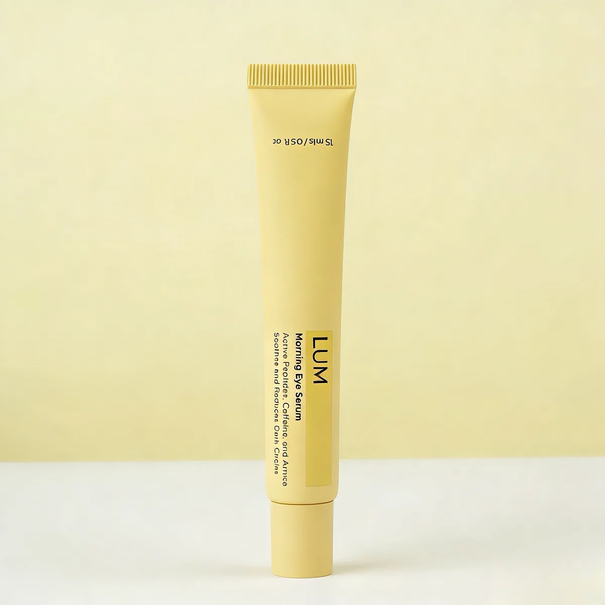 Functional eye care packaging manufactured by Lumlun, featuring the LUM logo on a vibrant yellow squeezable body.