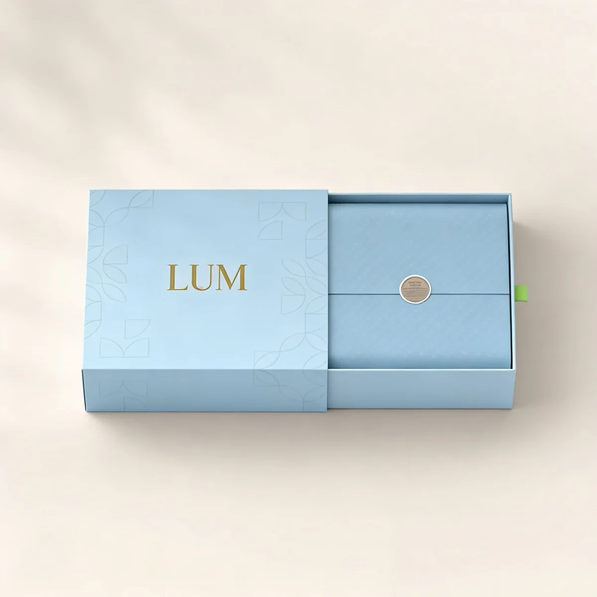 High-density outer sleeve showcasing custom offset geometric printing and an elegant color-matched ribbon pull.