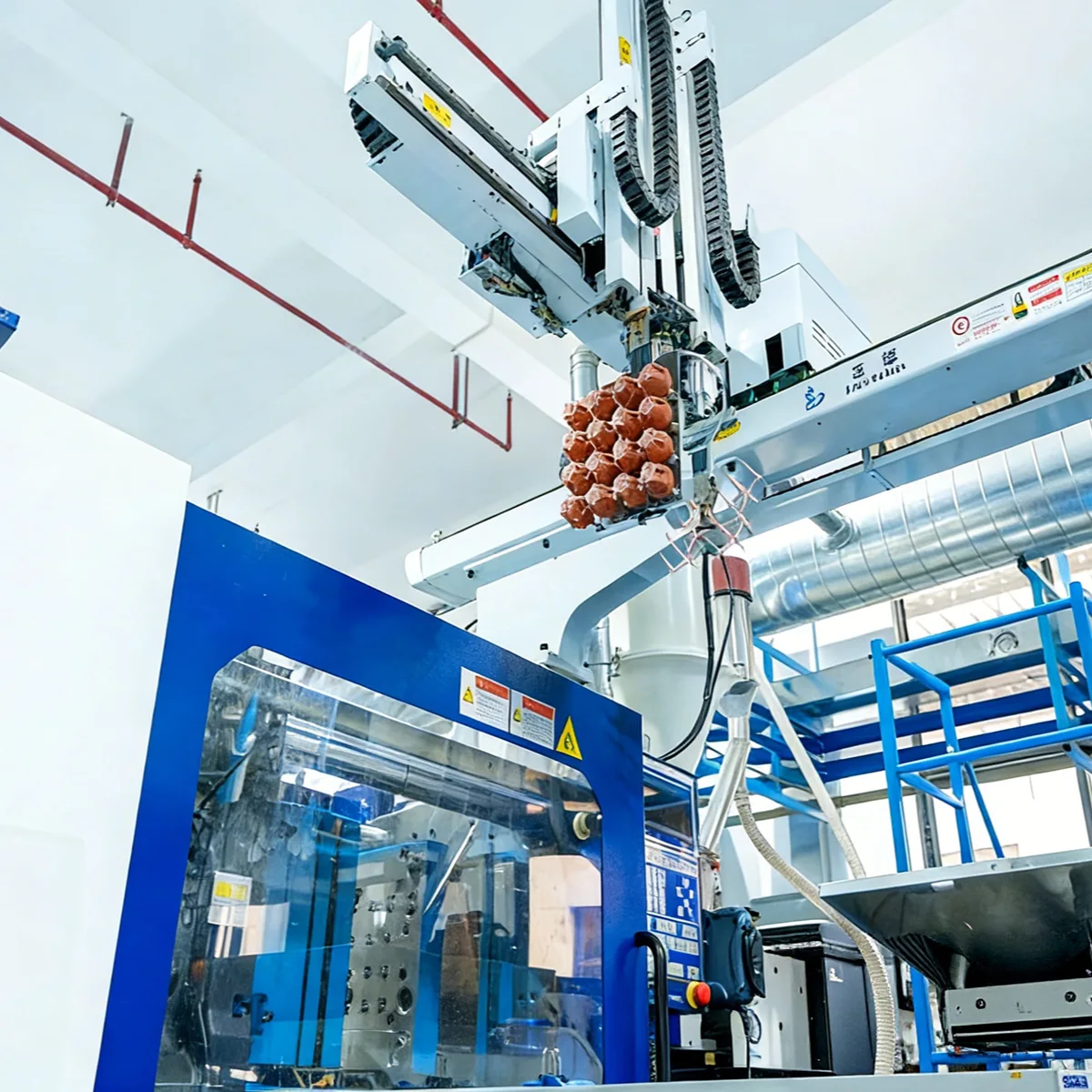 Advanced robotic automation system handling skincare bottle caps to ensure production efficiency and hygiene standards.