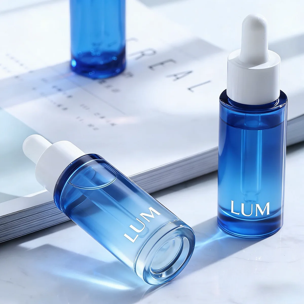 Custom translucent blue PET serum packaging manufactured by Lumlun, featuring the LUM logo for premium brand positioning.