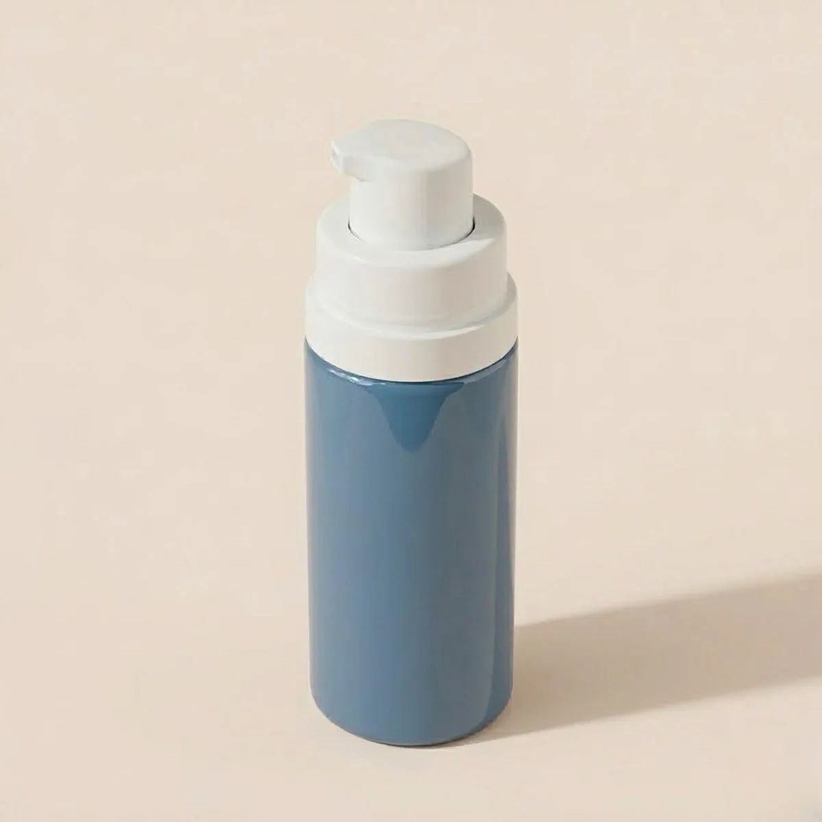 High-glossy UV coating on a deep blue airless bottle