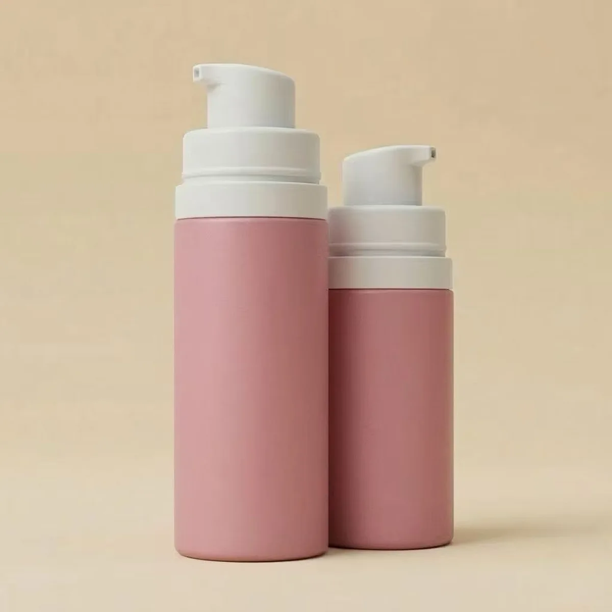Frosted matte surface finish on pink airless pump bottles