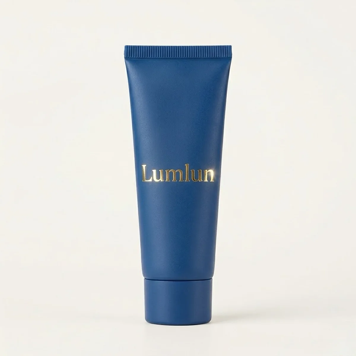 Navy blue cosmetic tube with sharp metallic gold foil hot stamping for premium branding.