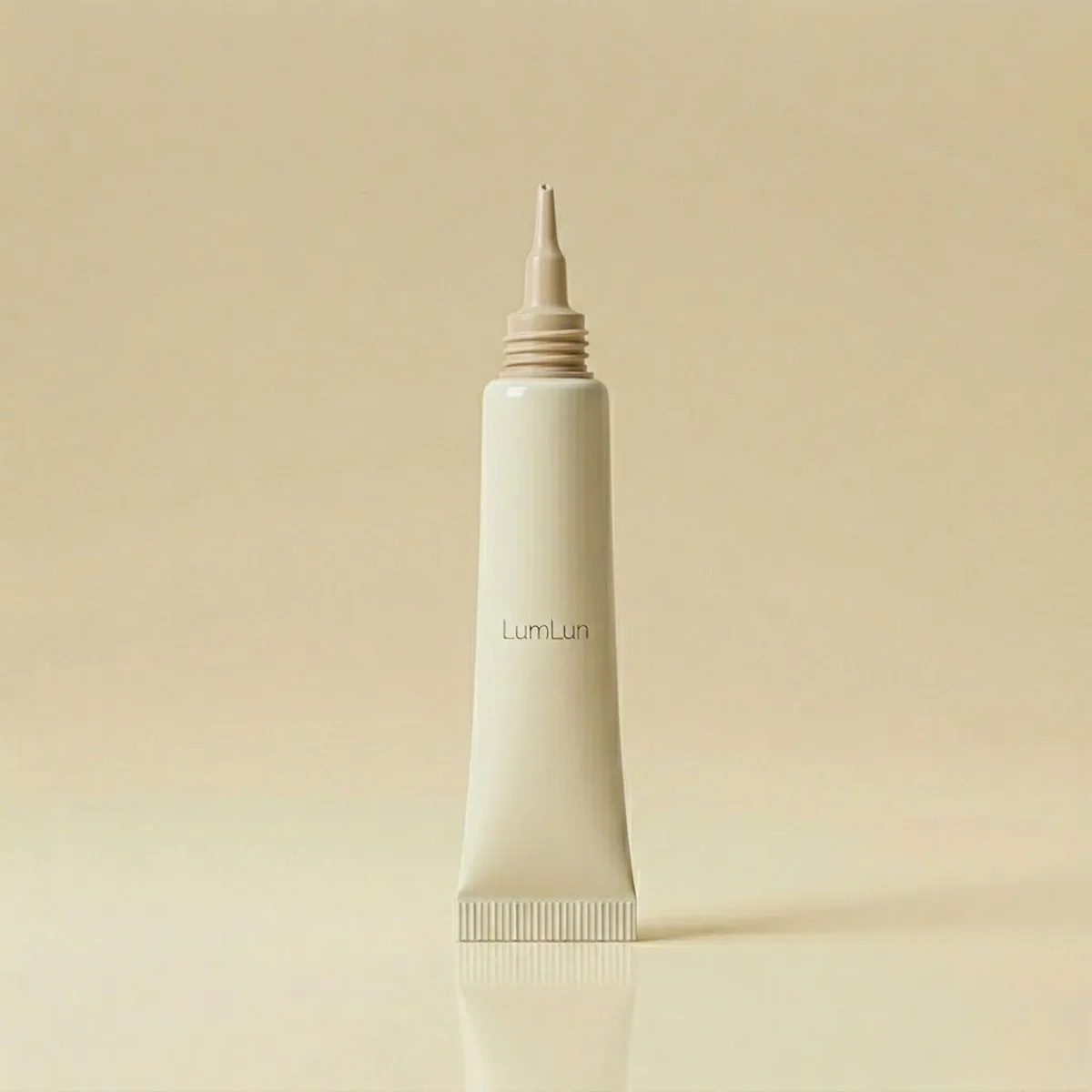 Slim cosmetic tube with a precision nozzle tip for targeted skincare application.
