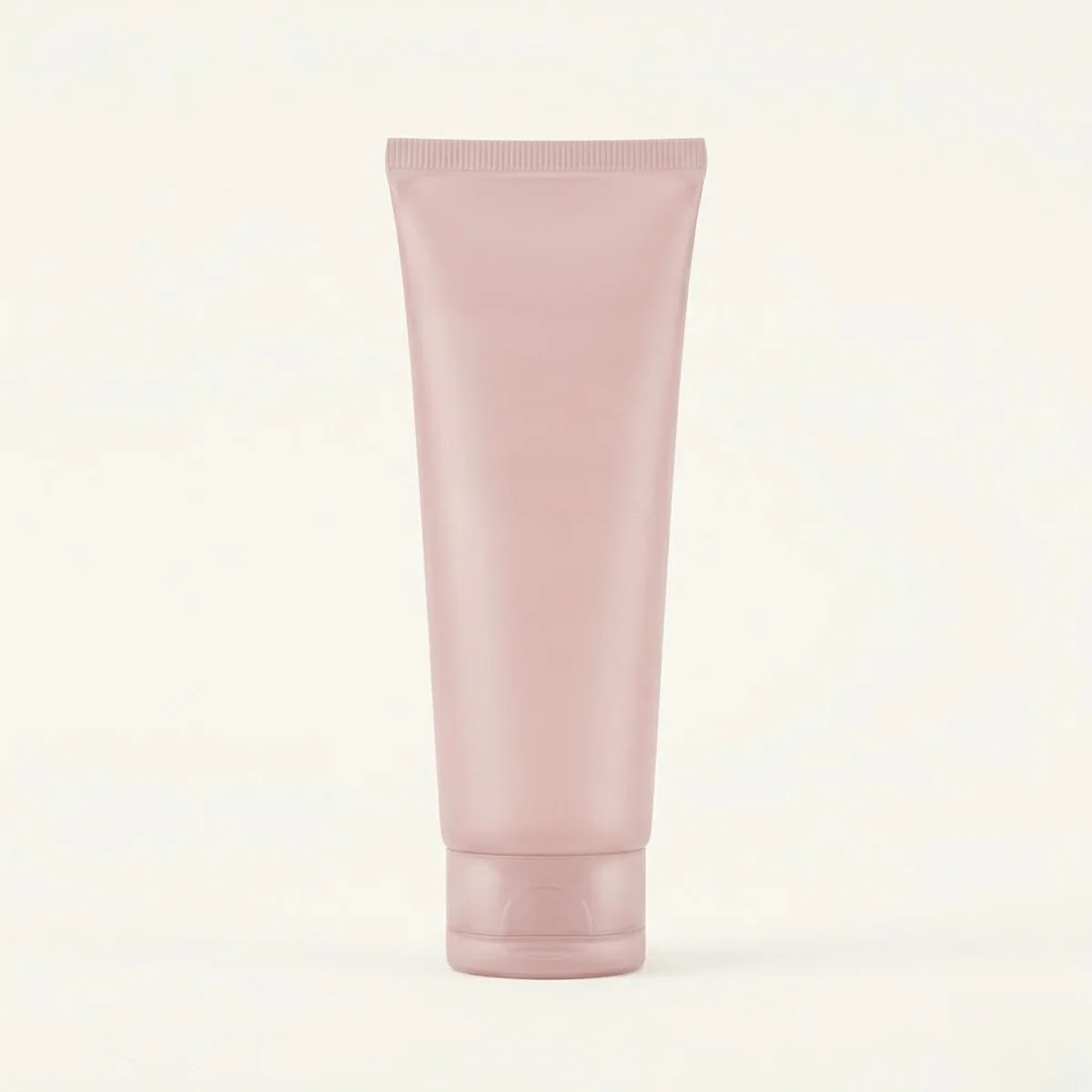 Soft-pink cosmetic tube with a premium non-reflective matte finish and velvety hand-feel.