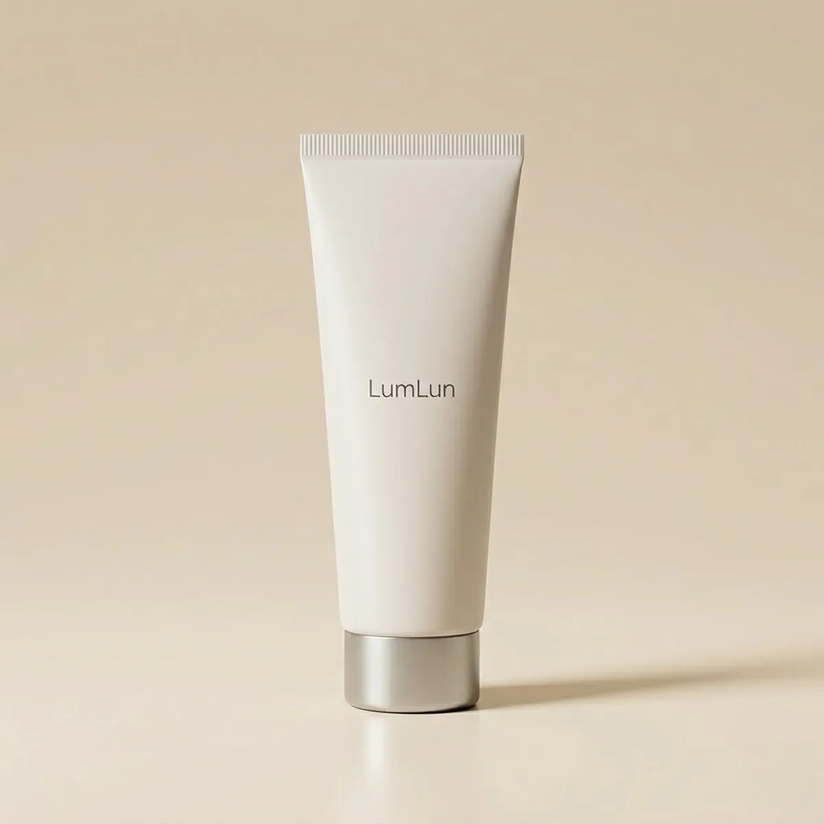 White cosmetic tube with a silver screw cap, a standard option from a cosmetic tube manufacturer.