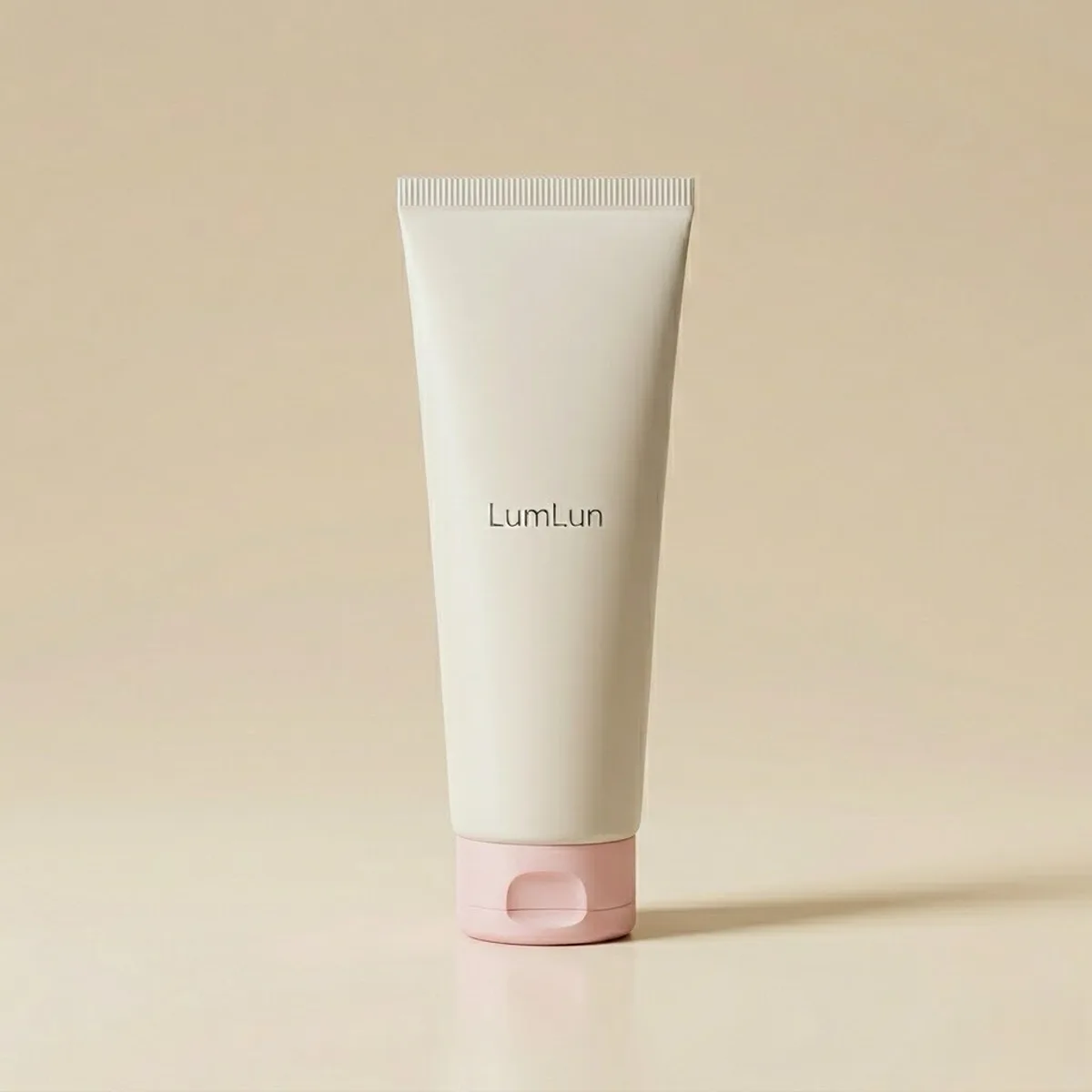 White plastic tube with a pink flip top cap, produced by cosmetic plastic tube manufacturers.