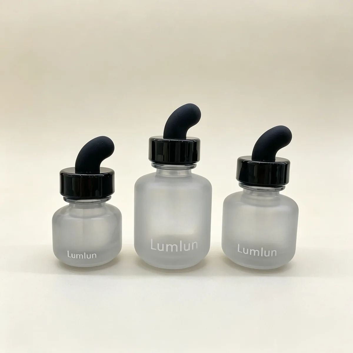 Collection of 15ml 30ml 50ml glass serum bottles with angled dropper teats
