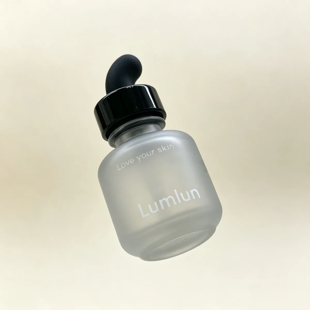 Close-up of ergonomic rubber bulb on a thick base glass oil bottle
