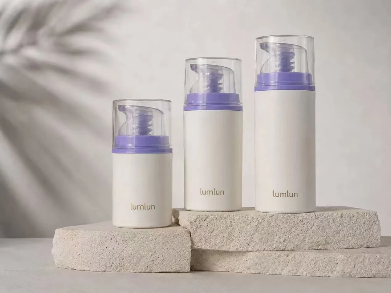 Three LumLun custom airless pump bottles in graduated sizes — airless bottle packaging for active skincare serum formulas