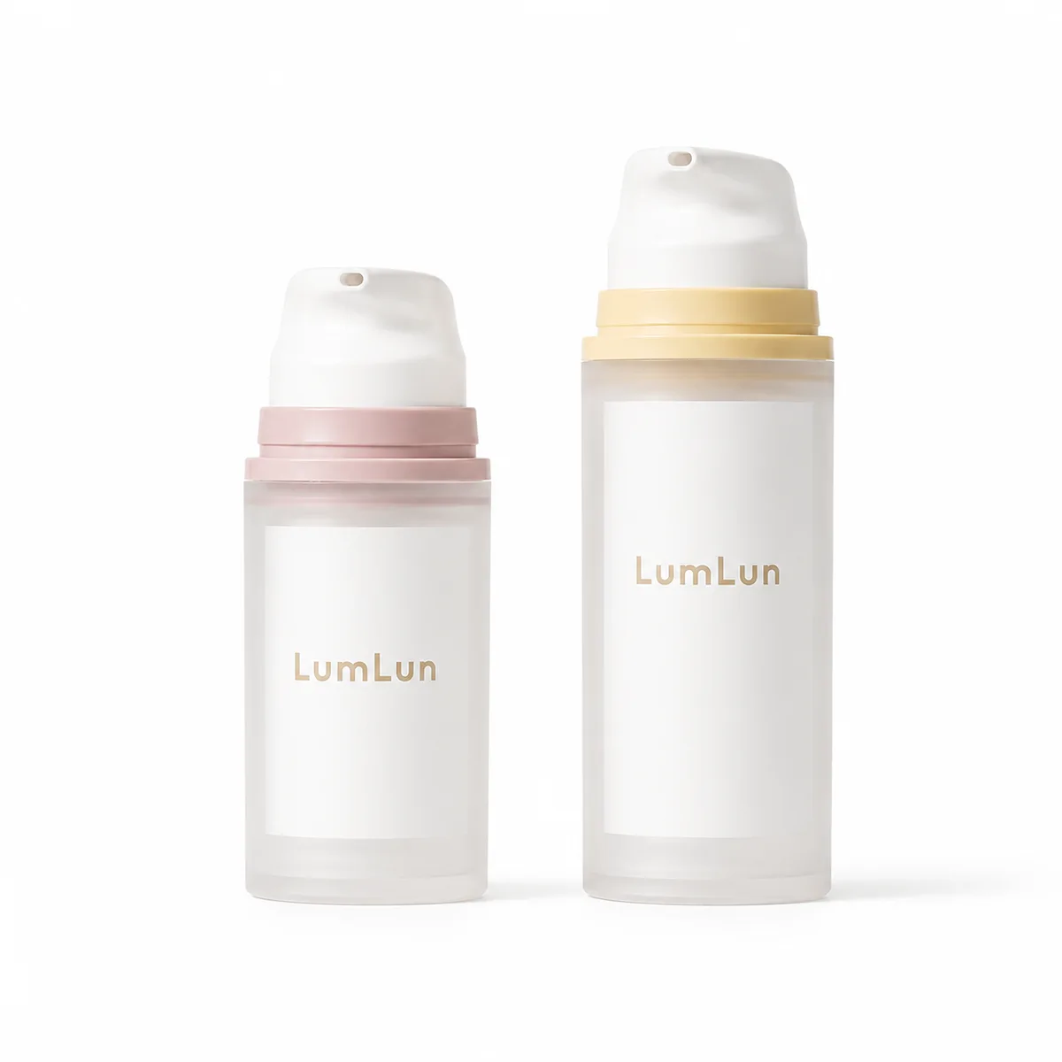 Front view of two frosted PP airless pump bottles side by side — 30ml with dusty pink collar and white pump head, 100ml with butter yellow collar and white pump head — on white background showing hot stamp LumLun branding, custom OEM airless serum lotion bottle