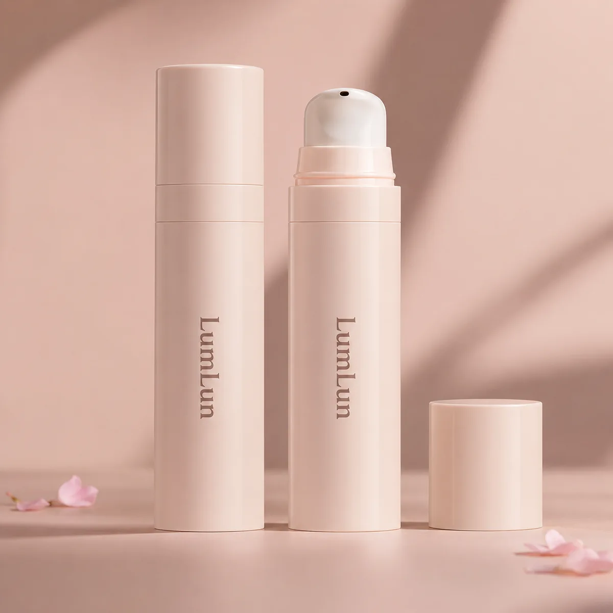 Two blush pink full-PP travel size airless pump bottles — 5ml to 15ml — one capped and one with dome pump head exposed, LumLun OEM custom serum and lotion packaging