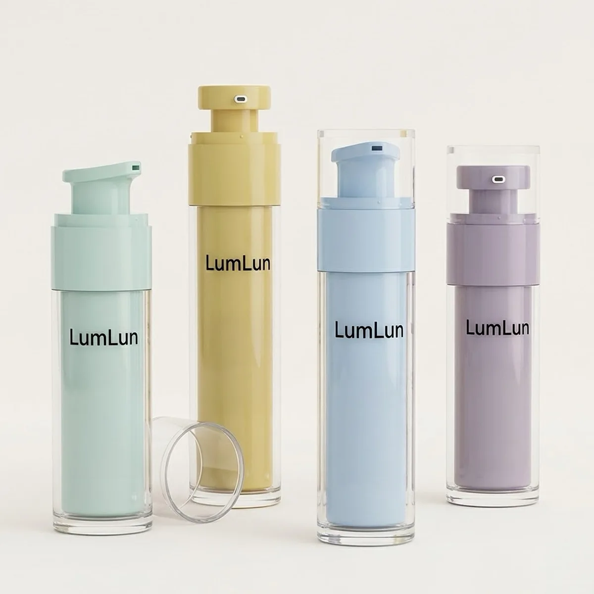 Four LumLun clear PS outer shell replaceable airless bottles in a row showing sage green, mustard yellow, sky blue, and lavender PP inner cores visible through transparent outer wall, with detached clear base ring beside first bottle, OEM custom colored inner airless bottle for serum and lotion skincare brands