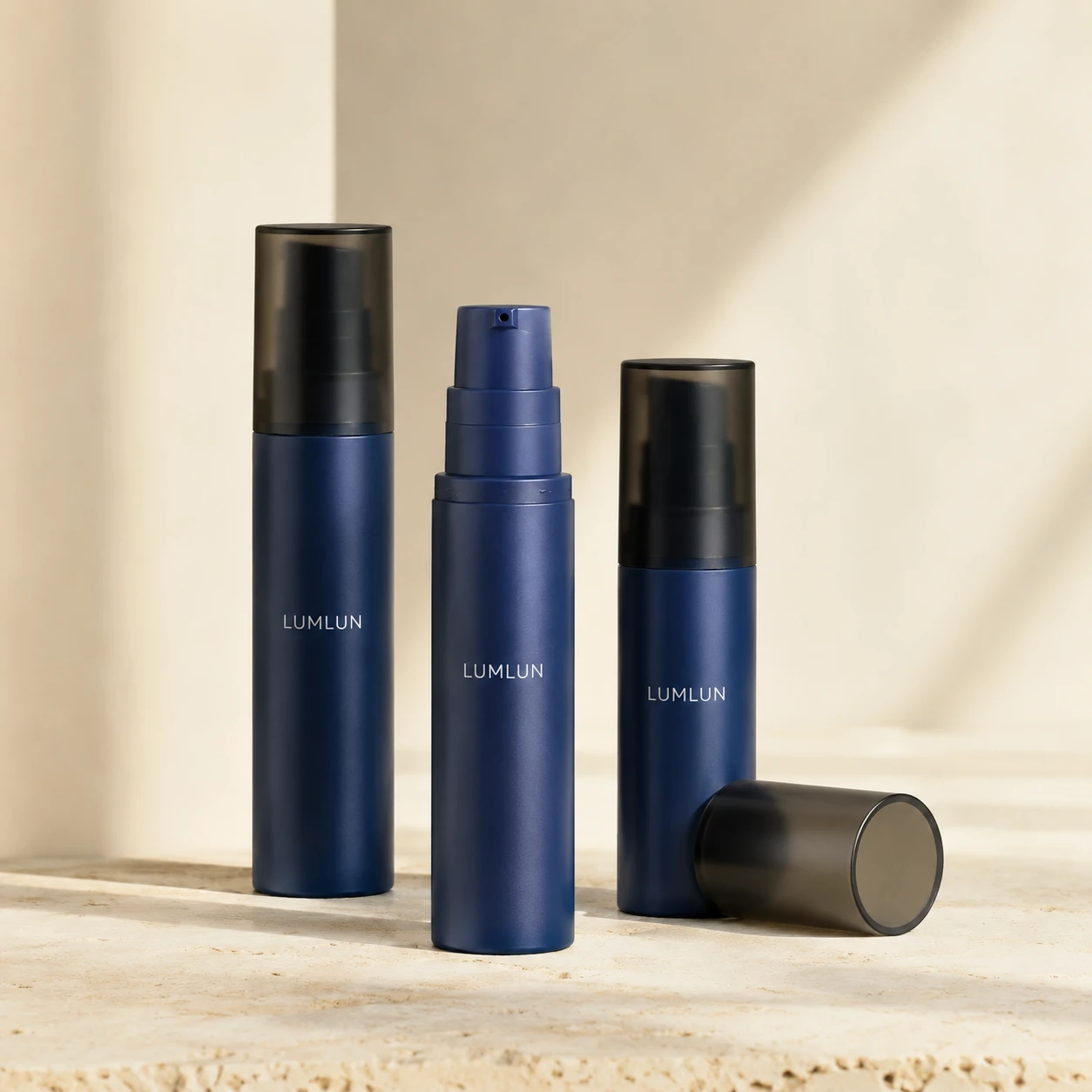 Mini airless pump bottle serum sample 5ml 8ml 10ml 15ml navy blue matte body translucent black overcap navy pump head three-bottle display OEM custom