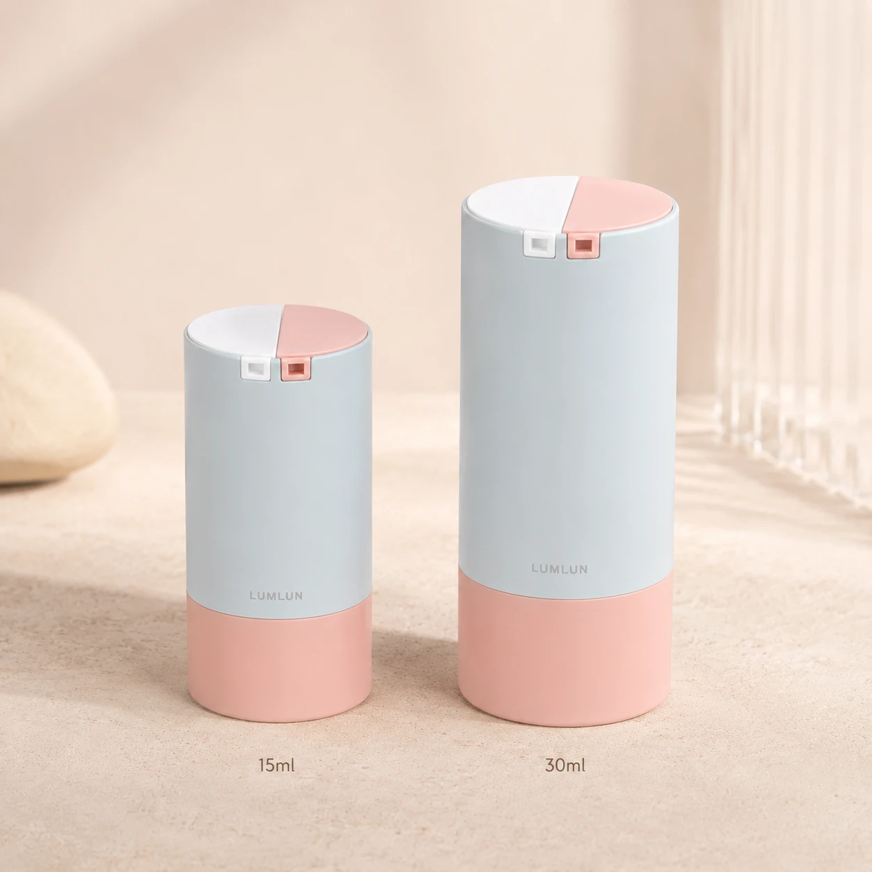 Rotary dual chamber lotion bottle 15ml and 30ml size comparison ABS cylinder blue gray body pink base twist-switch lid day night serum dual OEM custom