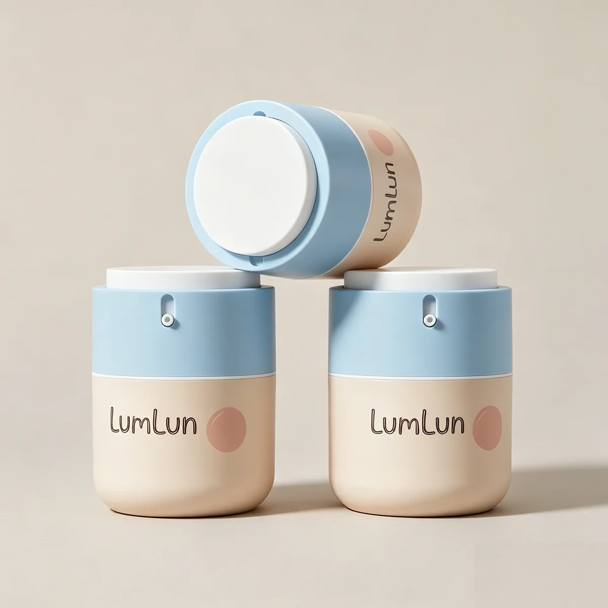 Stacked 50ml airless cream jars showing rotary pop-up actuator