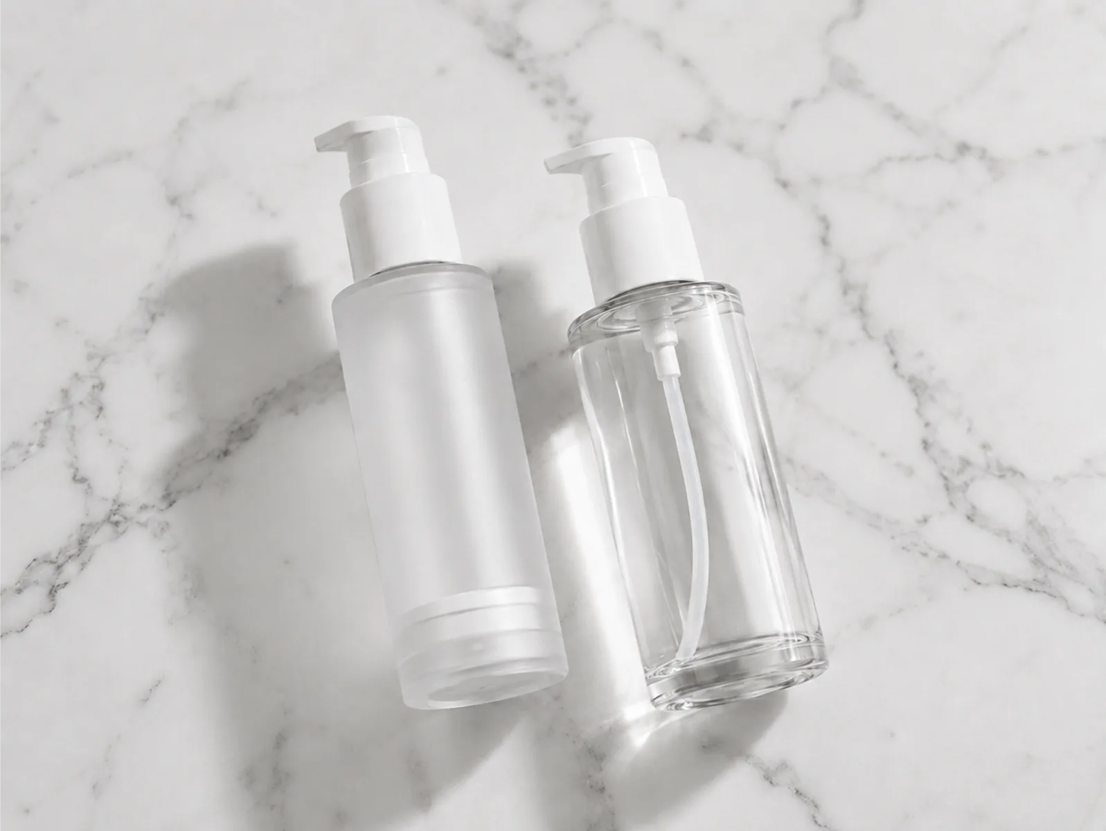 Airless pump bottle next to regular dip-tube pump bottle showing skincare packaging comparison for brands