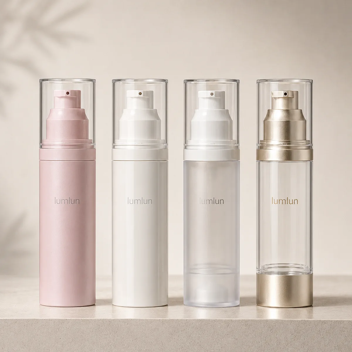 Custom airless bottles in different colors and finishes for a skincare brand showing branding options