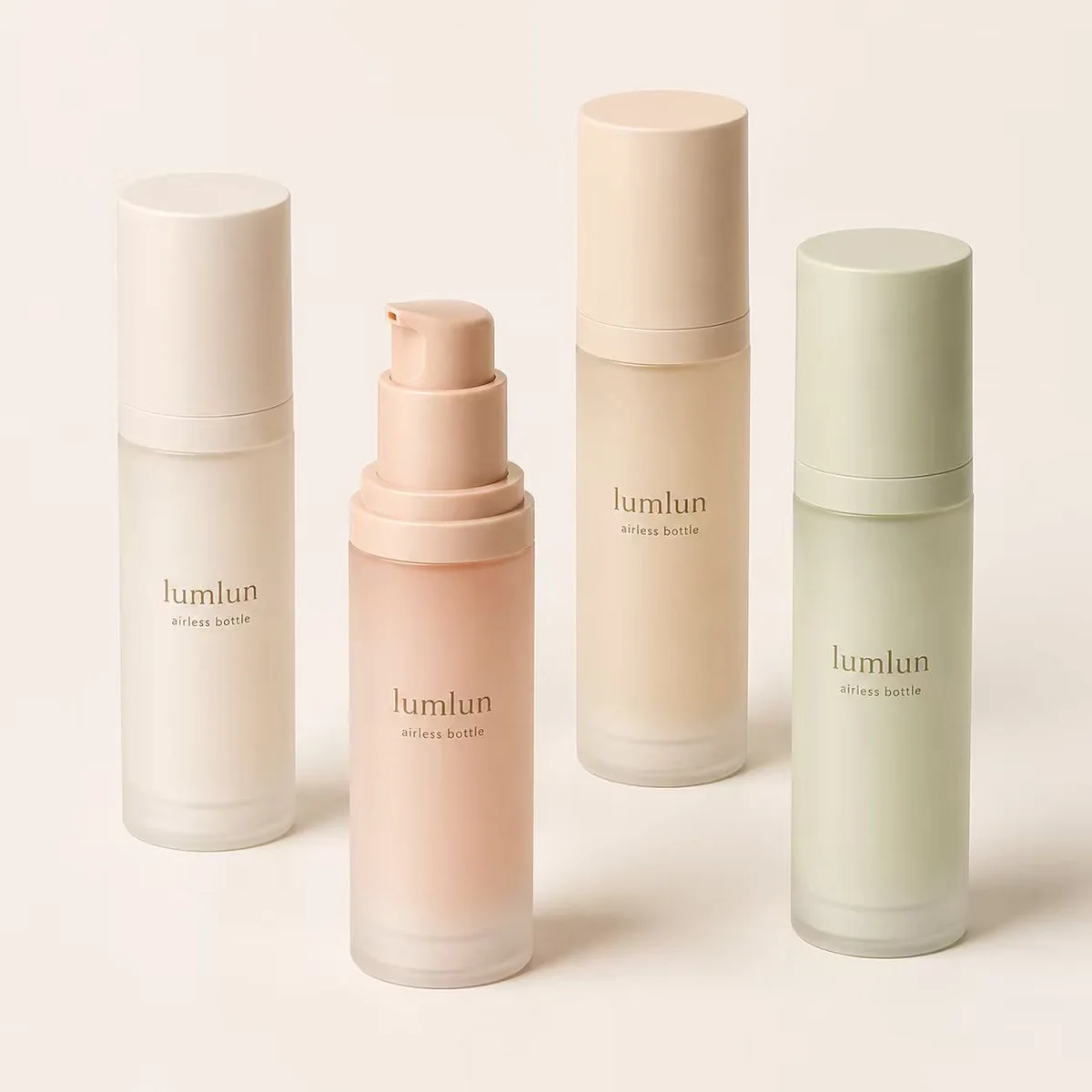 LumLun frosted airless bottles in cream, pink, beige and sage green, one with the pump exposed
