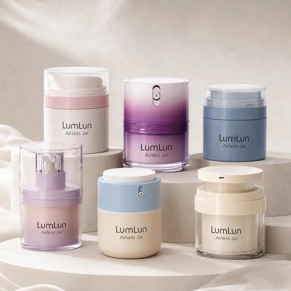 Six LumLun airless pump jars in pink, purple gradient, blue and cream colors with different finishes for skincare cream