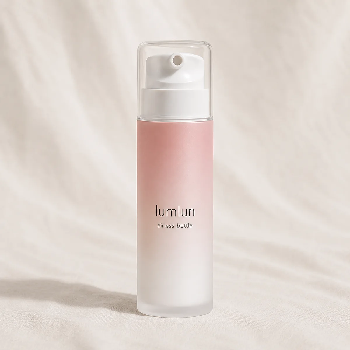 Lumlun PP airless toothpaste pump bottle in pink gradient with clear cap and white pump.