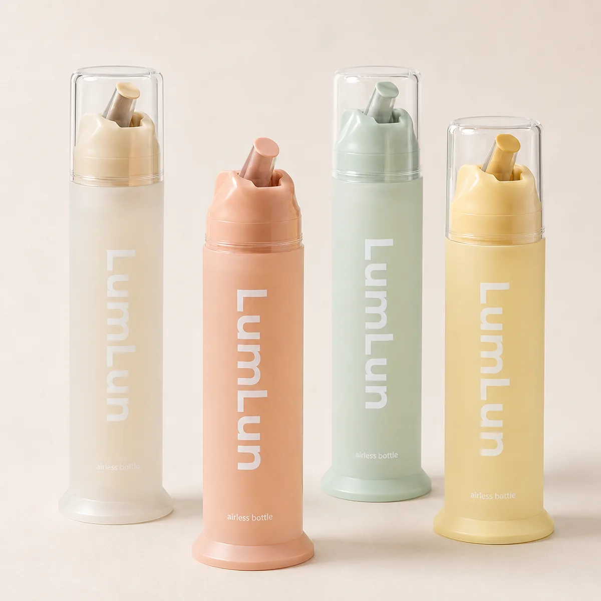 LumLun angled-nozzle airless bottles in cream, apricot, sage green and yellow, three with clear caps on