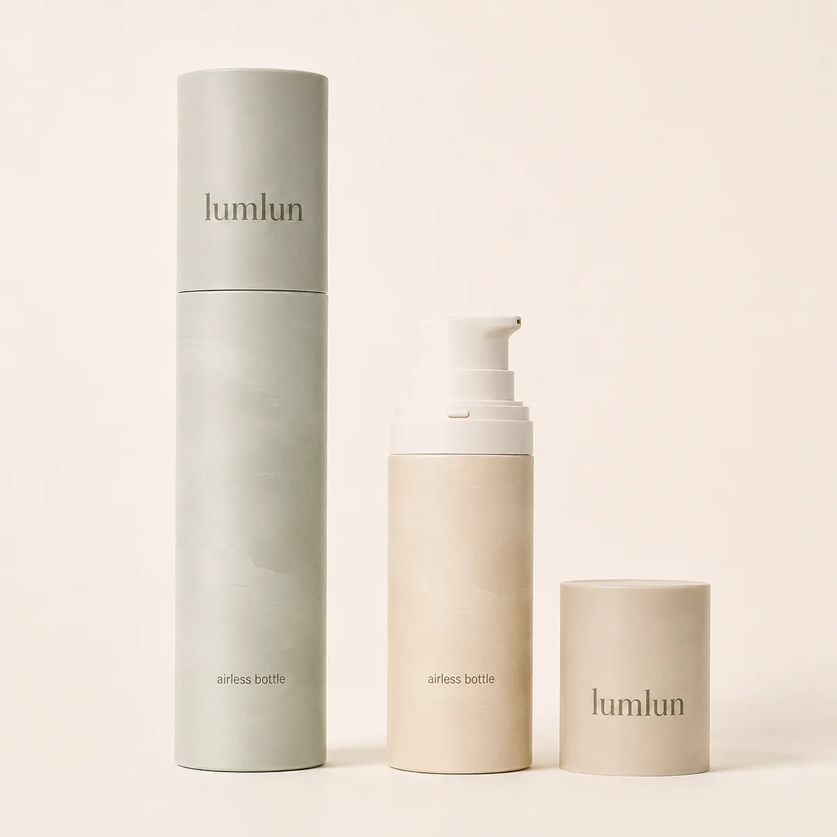 Lumlun refillable airless pump bottle and cap beside sage green tube packaging