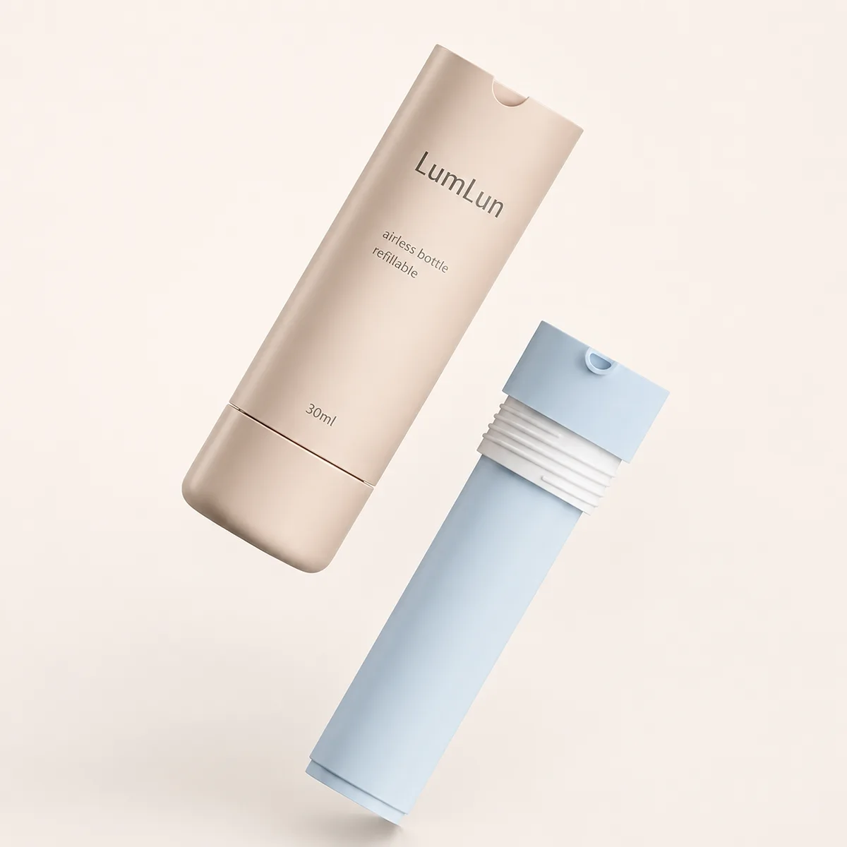 LumLun wiederbefüllbare 30-ml-Airless-Flasche in Champagnerfarbe mit blauer, austauschbarer Innenkartusche, die vom Außengehäuse getrennt ist.