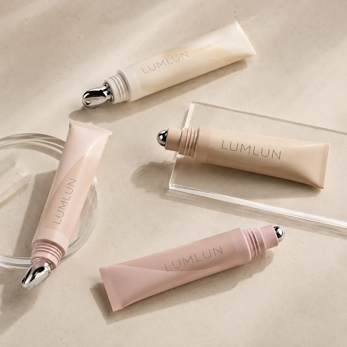 Four LumLun cosmetic tubes with metal rollerball and silver alloy massage applicator tips for cooling eye serums and treatments