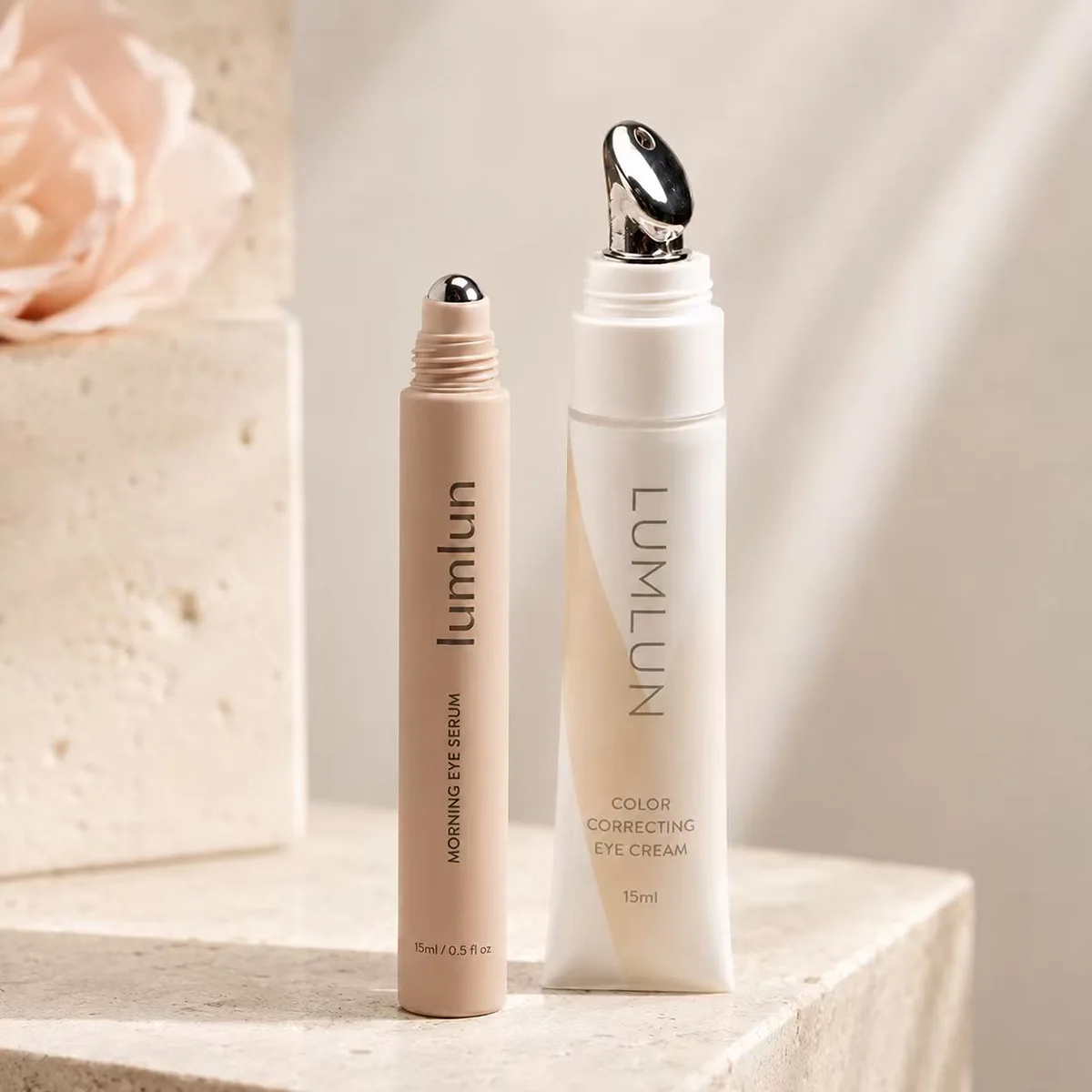 Two LumLun skincare tubes showing a metal rollerball applicator tip and a silver alloy massage applicator tip for serums