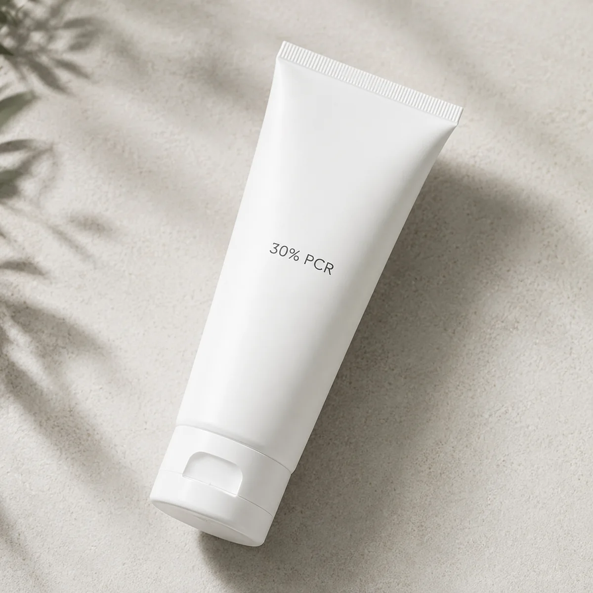 White cosmetic tube labeled 30% PCR showing clean recycled-content appearance without gray tint for skincare packaging