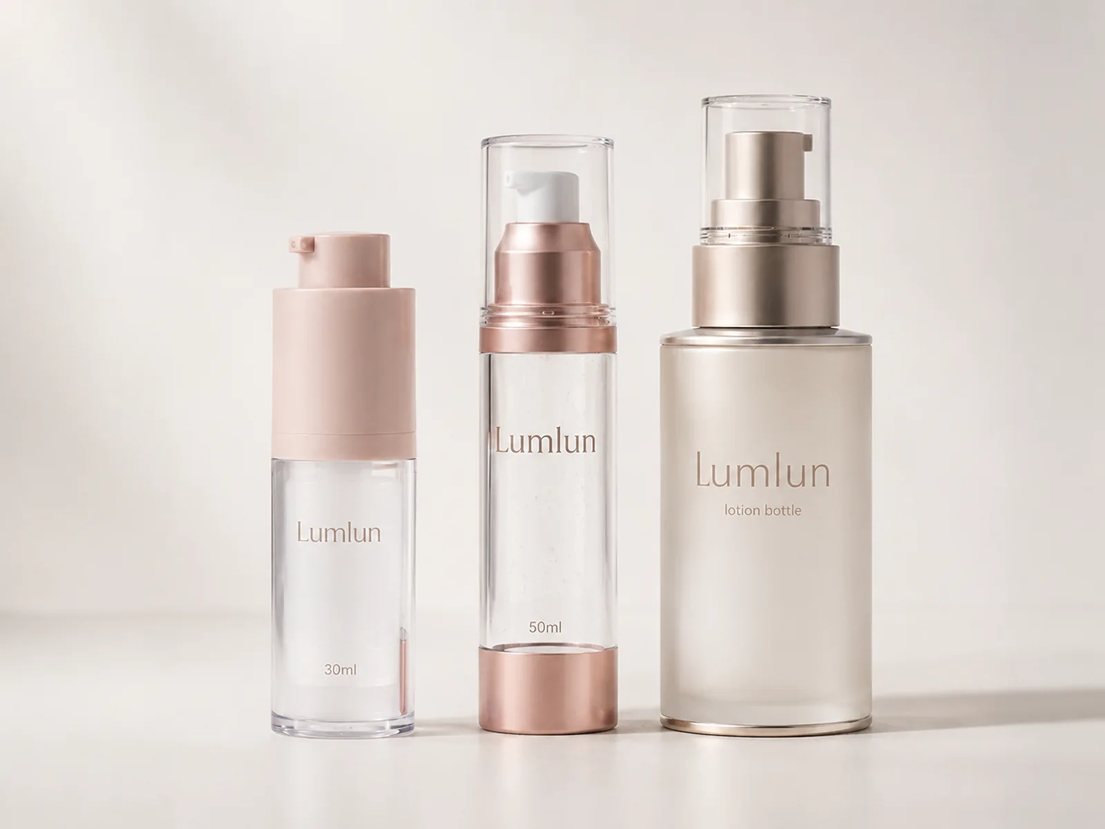 Three LumLun pump bottles including 30ml and 50ml airless bottles and one larger cream lotion pump bottle