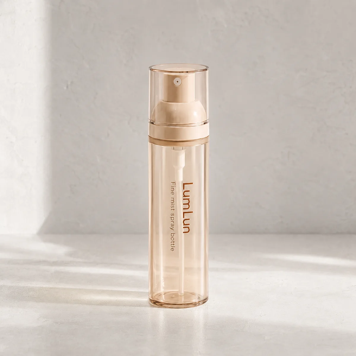 Single Lumlun fine mist spray bottle in amber translucent finish with a clear cap.