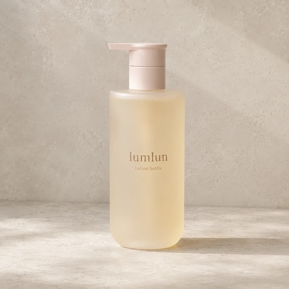 Single yellow Lumlun frosted lotion pump bottle with a pale pink dispenser on a neutral surface.