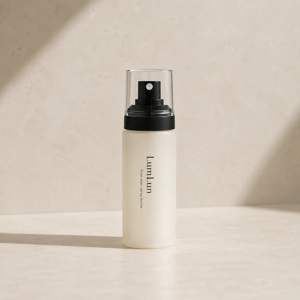 Single Lumlun fine mist spray bottle in white with a black pump and clear cap.