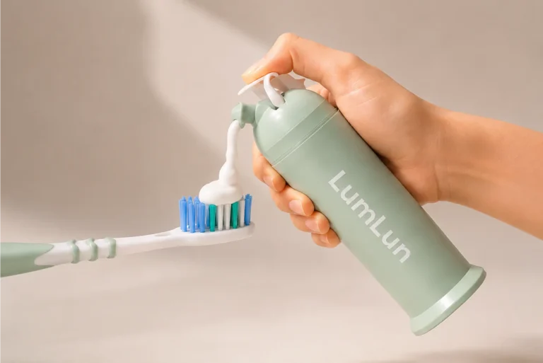 LumLun airless toothpaste pump bottle dispensing toothpaste onto a toothbrush for clean daily oral care