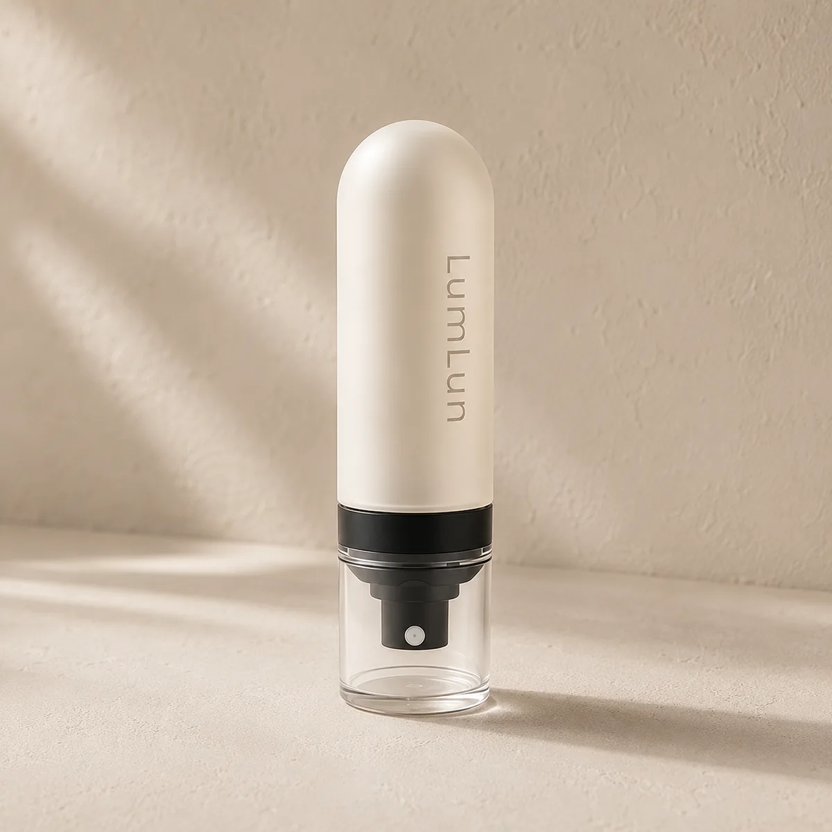 Single cream Lumlun capsule fine mist spray bottle with a rounded frosted cover and clear base.