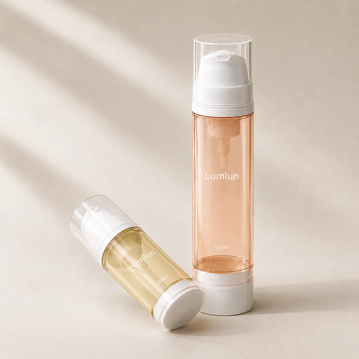 Clear-body PP airless foaming pump bottles in yellow 50ml and orange 100ml with white pumps and clear caps