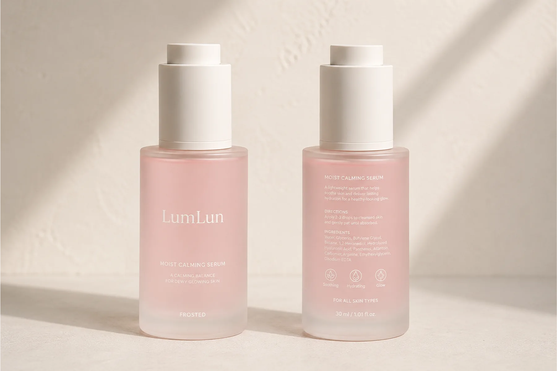 Front and back views of a frosted Lumlun serum bottle showing clean branding and product information layout