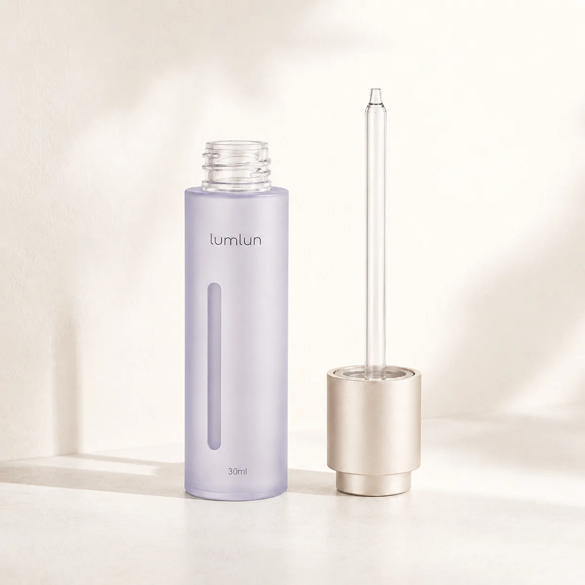 A PETG twist press dropper bottle shown open with a long internal tube displayed beside it.