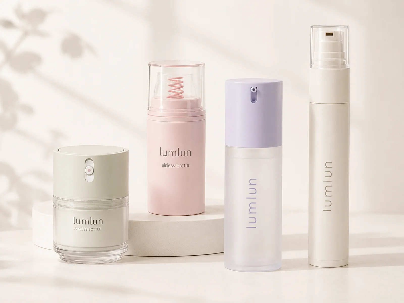Four LumLun airless skincare packages in short, standard and tall formats with cream, pink, lavender and soft green finishes