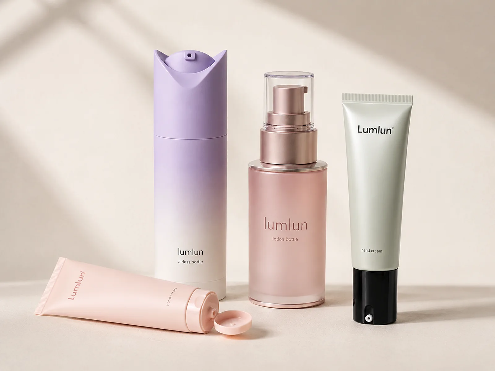 Four LumLun hand care packages including two squeeze tubes, one airless bottle and one lotion pump bottle in pastel finishes