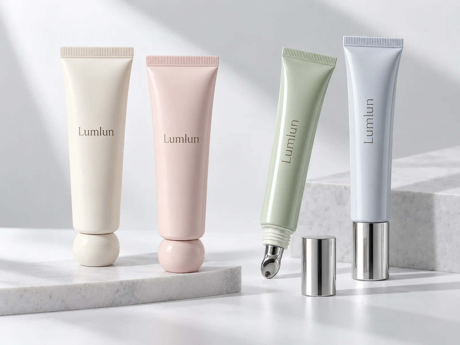Finished LumLun cosmetic tubes showing standard squeeze tube and lip care applicator tube formats after filling and assembly