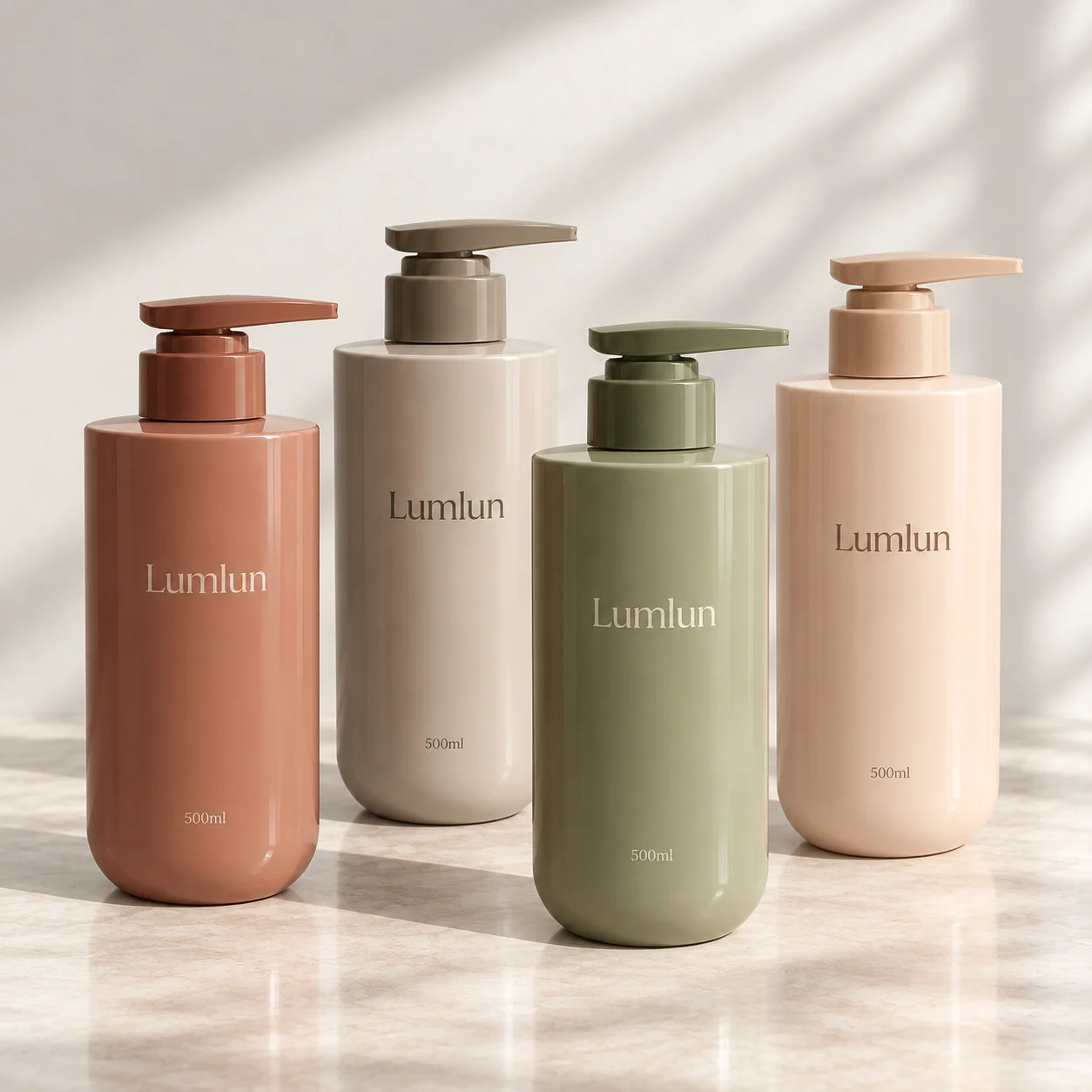 Four straight-shoulder 500ml PET pump bottles in terracotta, beige, olive and cream