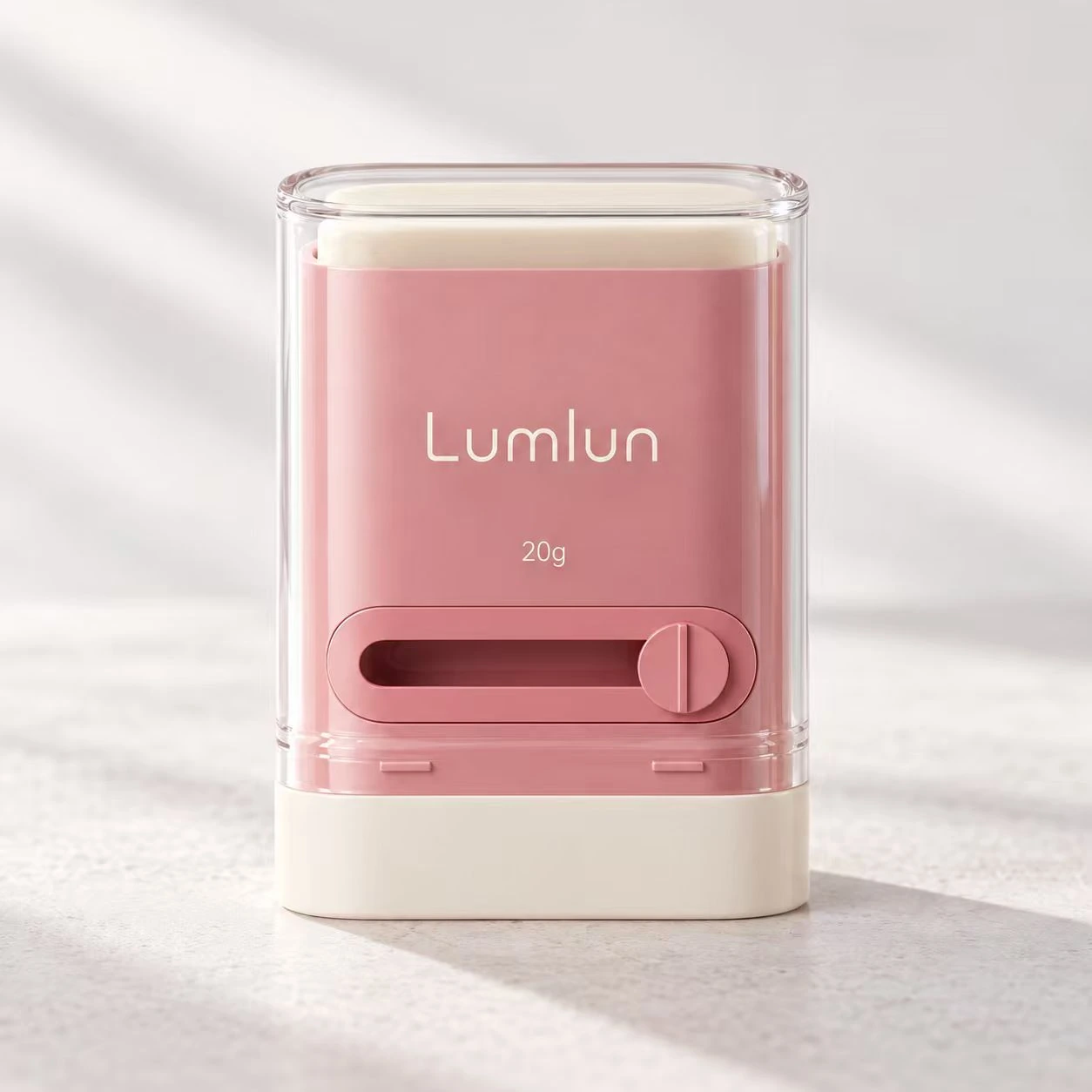 Envase stick LumLun de PP de 20 g en rosa visto de frente con el mecanismo deslizante